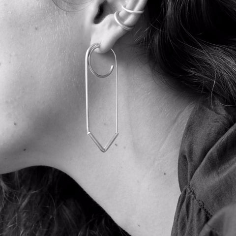 Elegant rectangle V shaped earring with a three-quarters circle that makes the illusion of two earrings in the same hole.