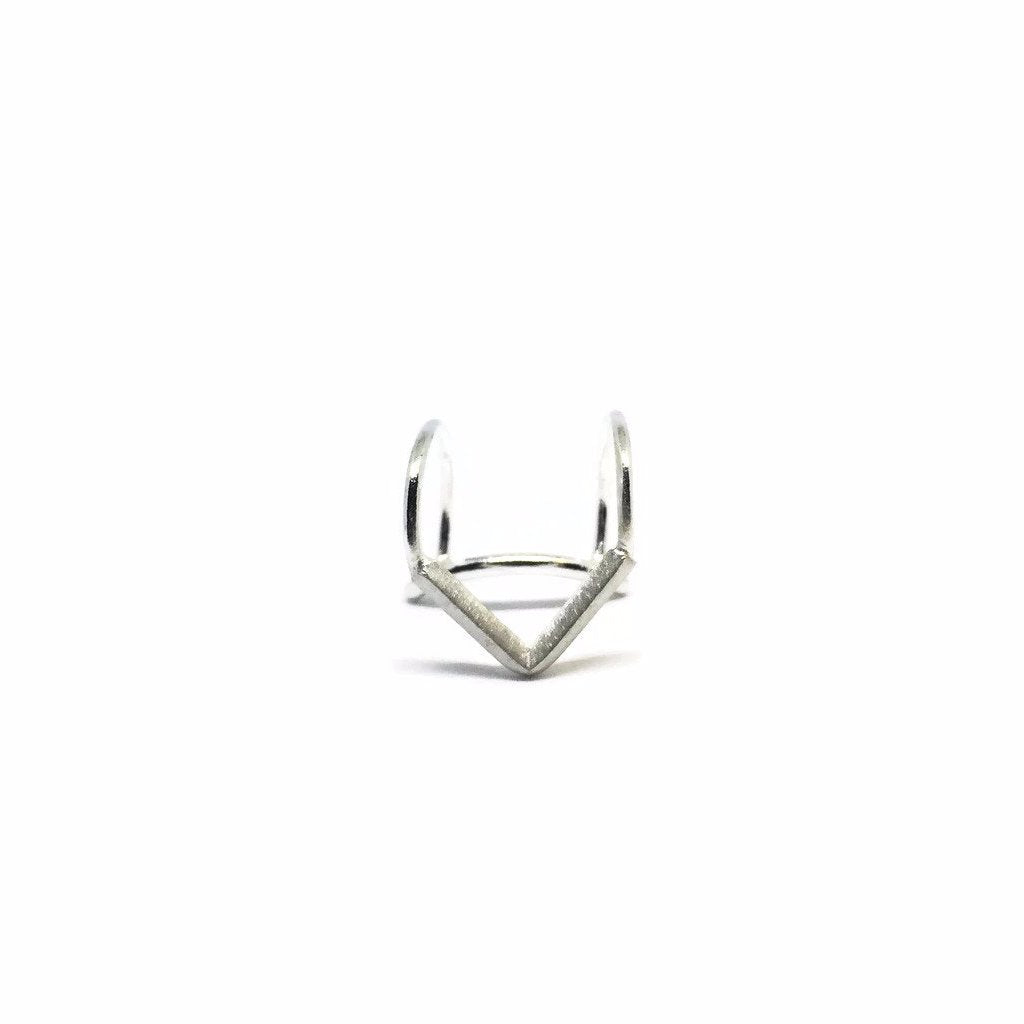Geometric delicate V shaped upper cartilage ear cuff. The ear cuff have a comfortable hidden "seat" making it secure to wear.